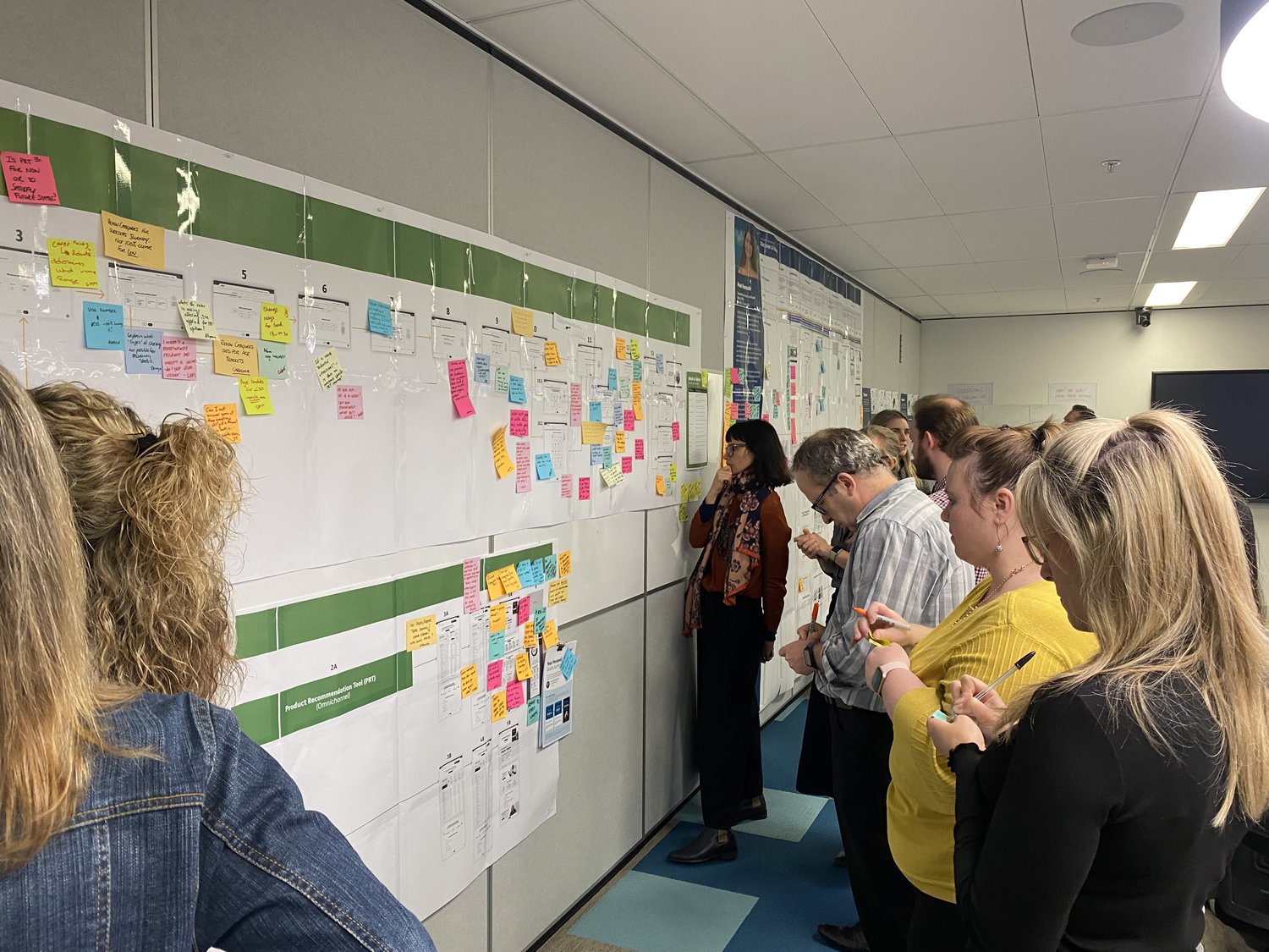 Stakeholders reviewing feature boards in a prioritisation workshop